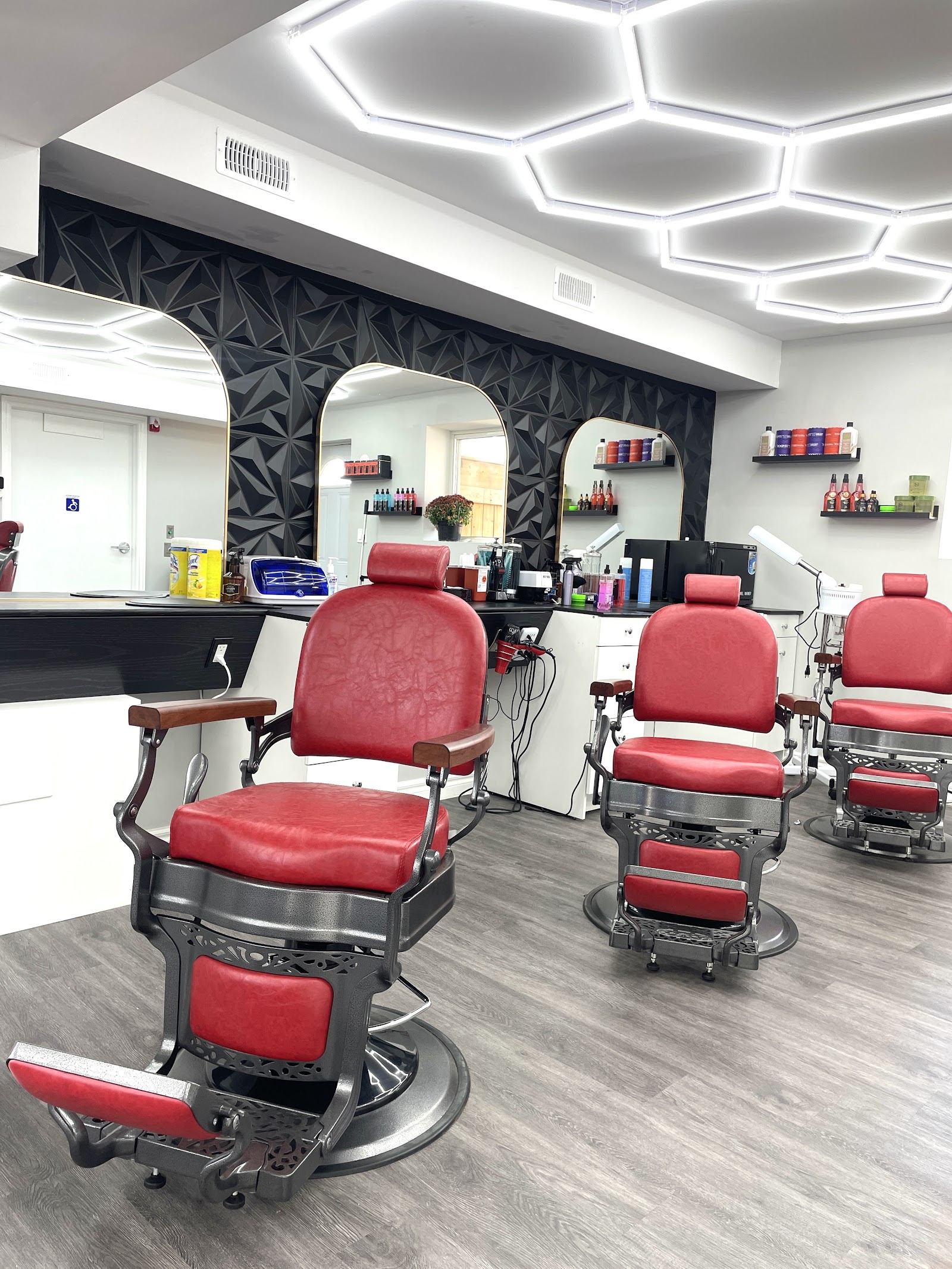 Sam's Scissors Barbershop interior with red barber chairs